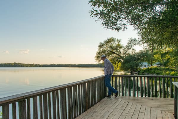 Lake on the Mountain Provincial Park showing a lake or waterhole and a sunset as well as an individual male