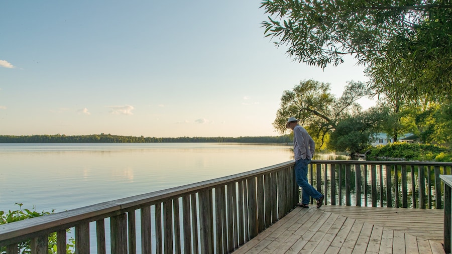Lake on the Mountain Provincial Park showing a lake or waterhole and a sunset as well as an individual male