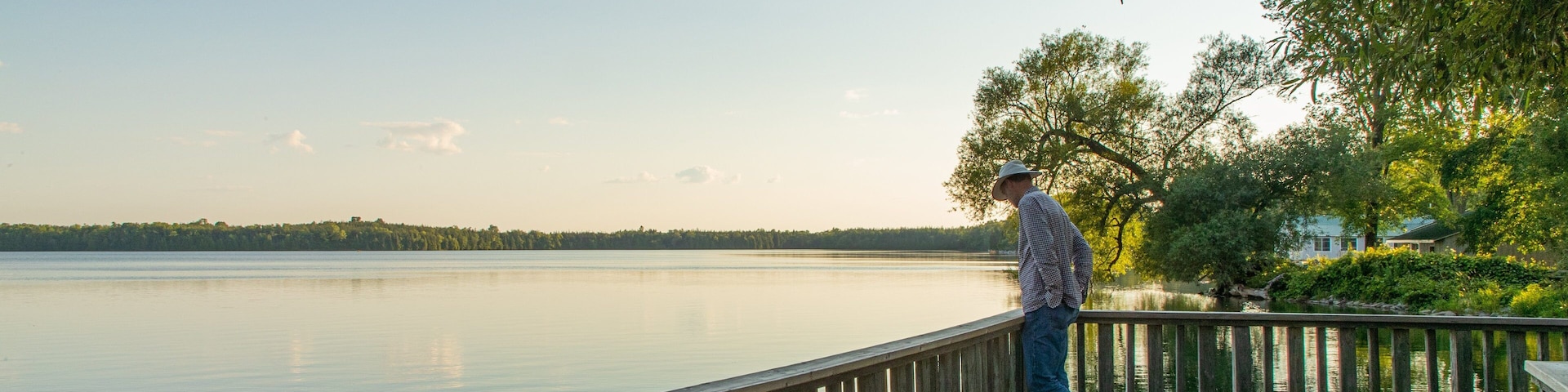 Lake on the Mountain Provincial Park showing a lake or waterhole and a sunset as well as an individual male