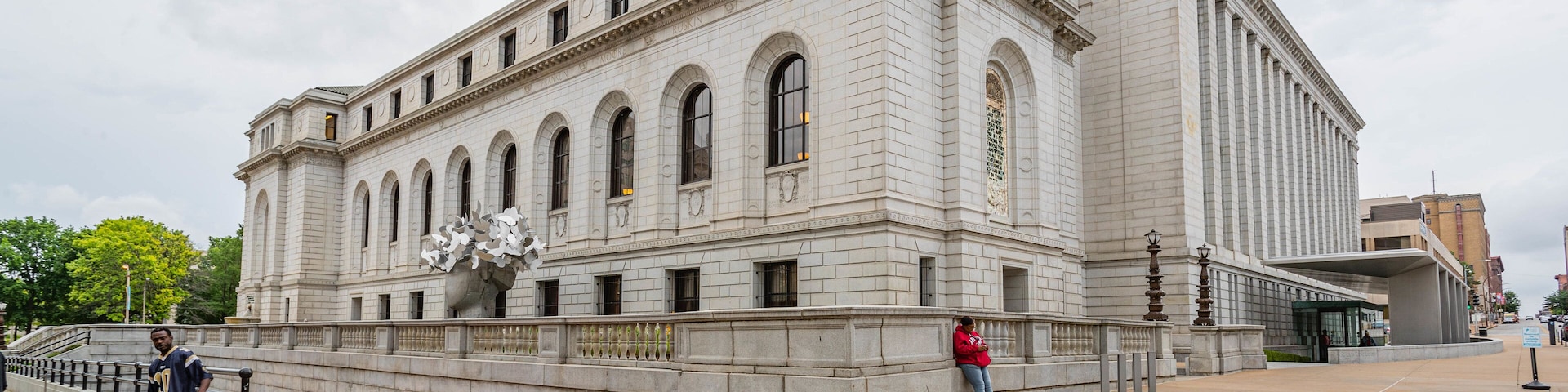 A large, historic building with arched windows and a prominent entrance.
