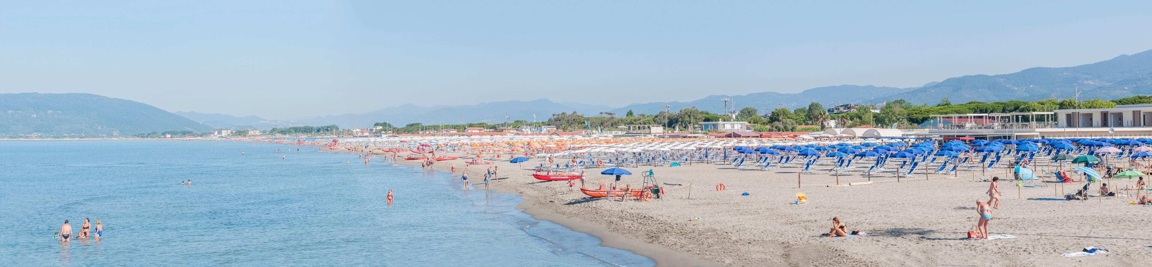 Large panorama of the beaches and seaside resorts of Marina di Carrara, Tuscany in Italy after anti-covid-19 measures