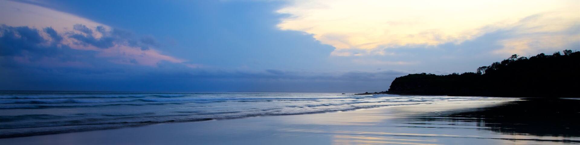 Pebbly Beach showing a beach, general coastal views and a sunset
