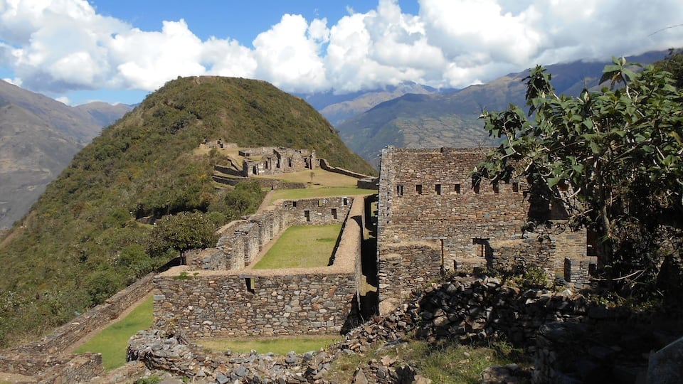 The ancient ruins of Machu Picchu with a mountain backdrop.