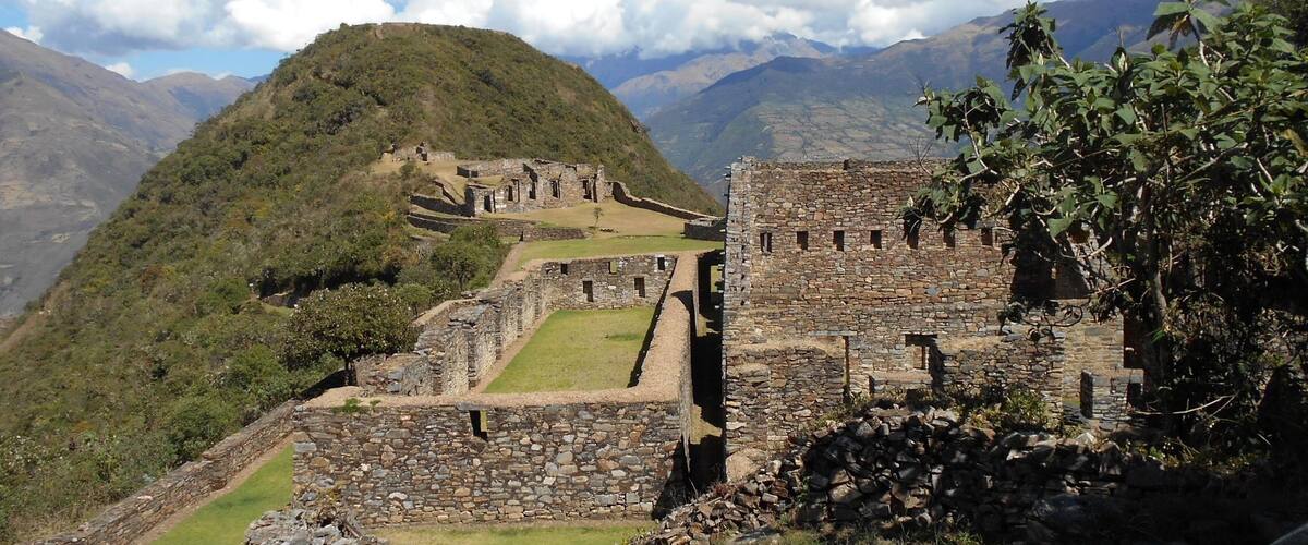 The ancient ruins of Machu Picchu with a mountain backdrop.