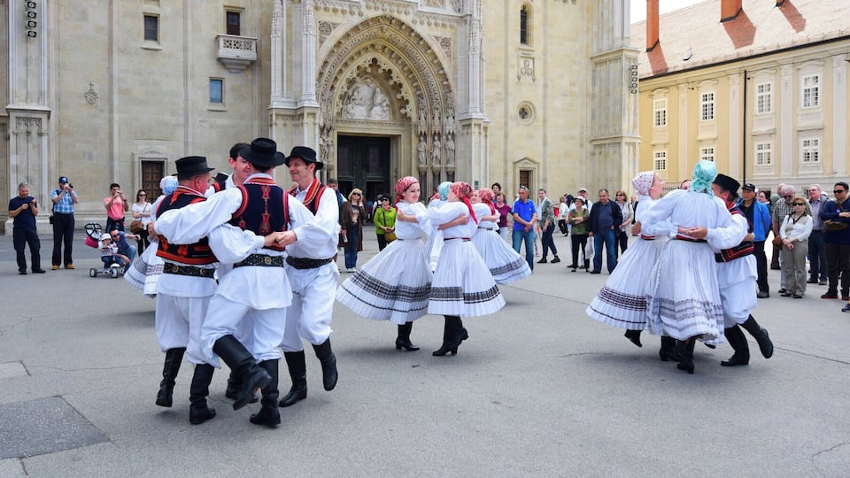 A performance by local artists in the cathedral square on a Sunday morning.
