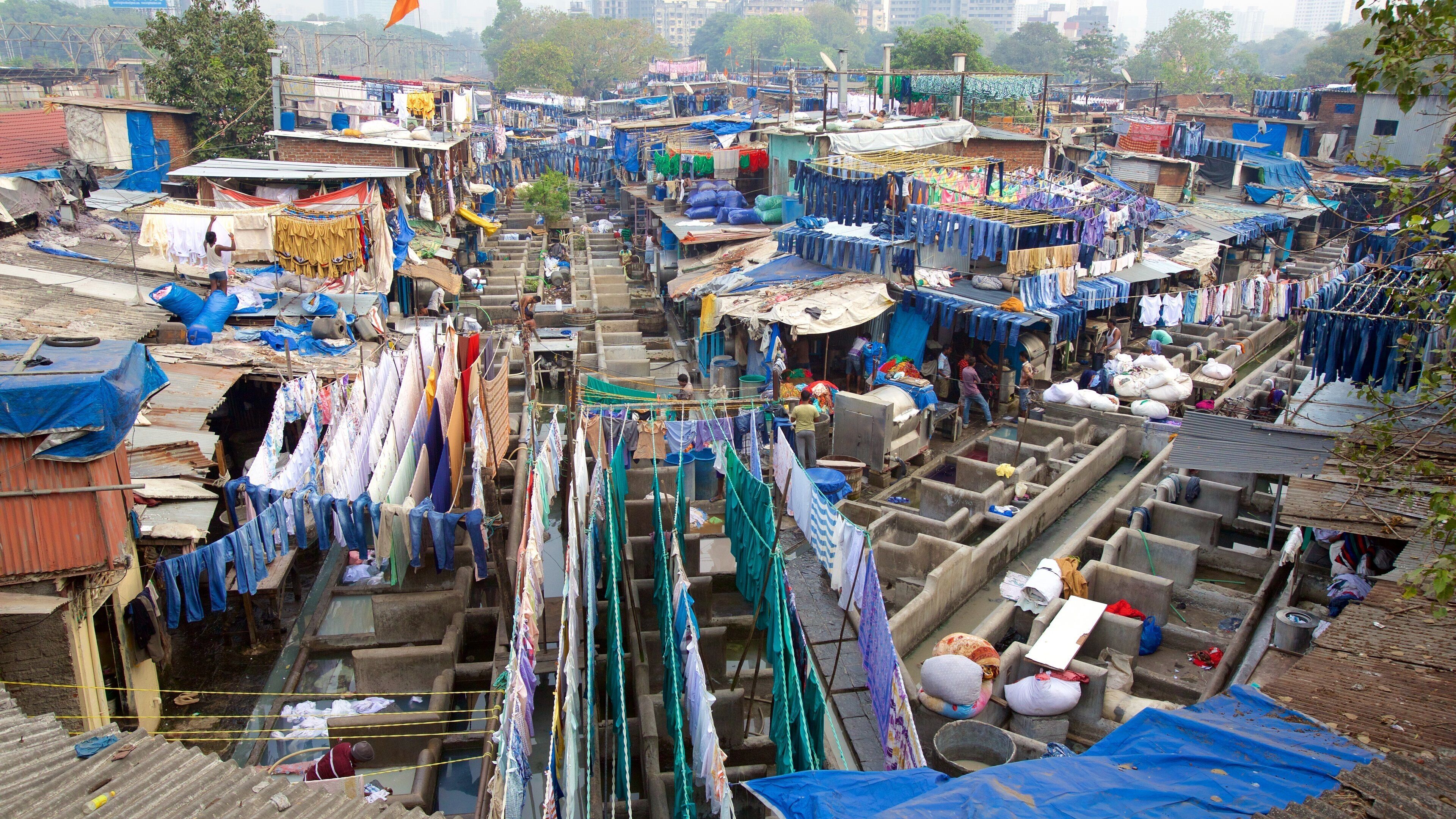 A densely packed urban area with numerous makeshift buildings and clotheslines.