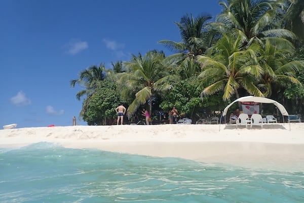 A piece of paradise in the Caribbean - Rocky Caye Beach is a short boat ride from San Andres in Colombia. Walk along the white sandy beaches or jump into the clear blue sea! #LifeAtExpedia