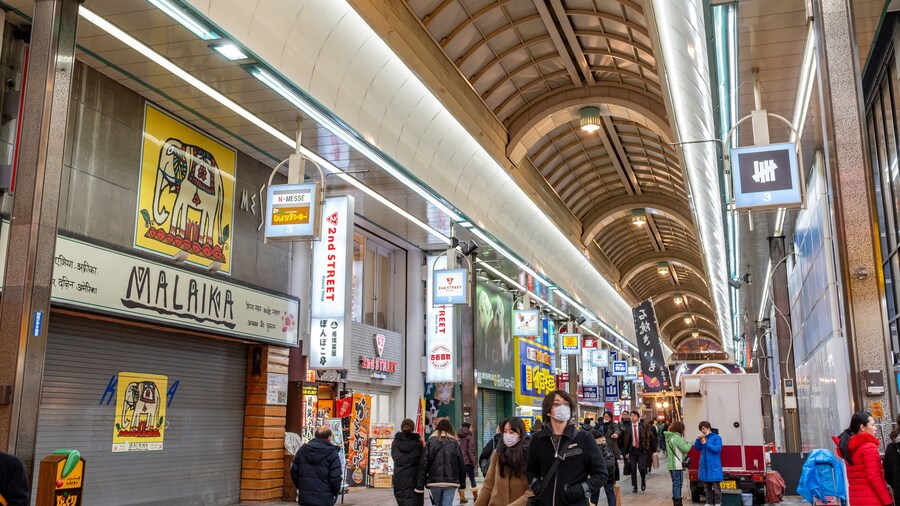Tanukikoji Shopping Street which includes signage, shopping and interior views
