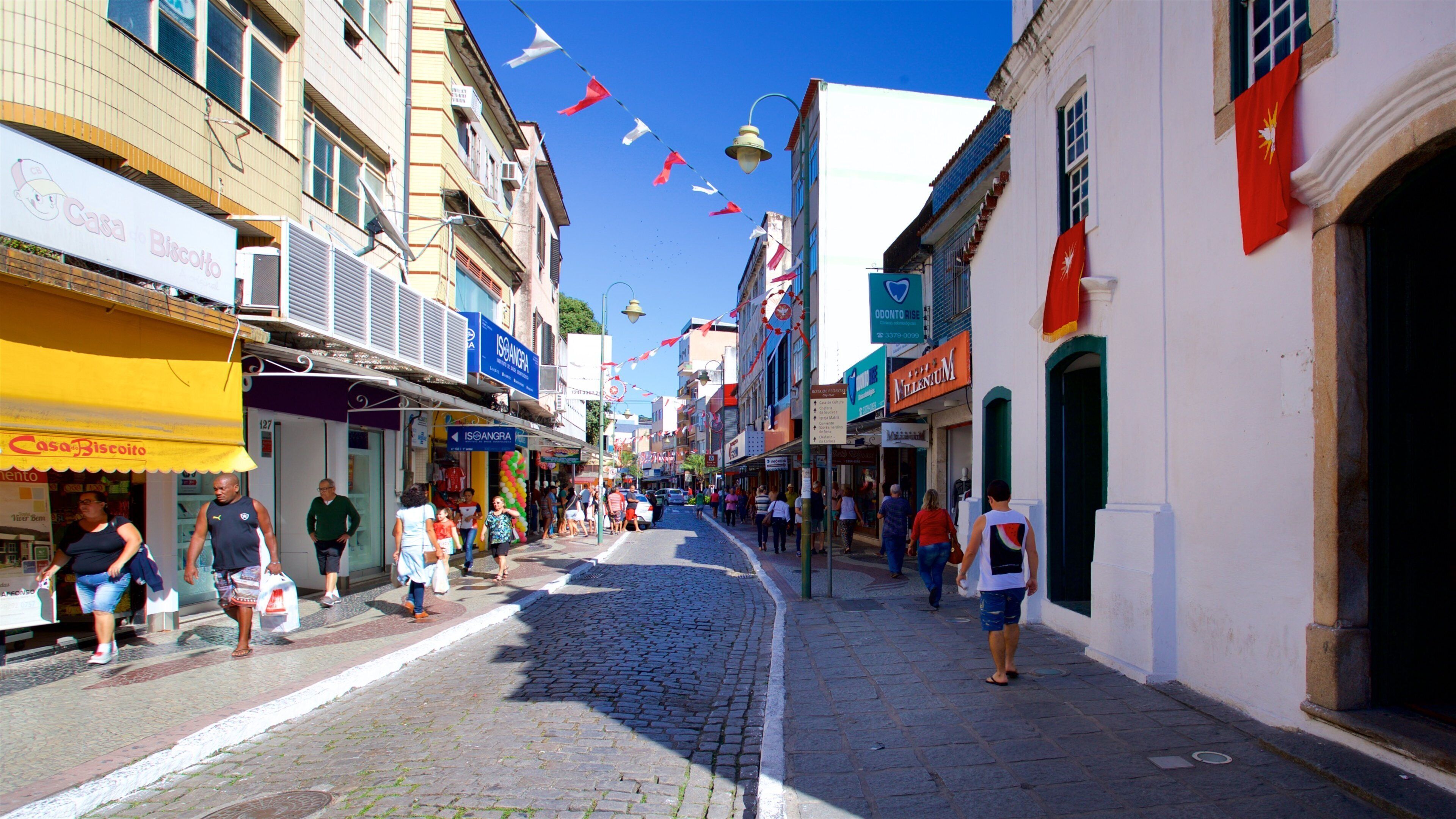 Santa Luzia Church which includes a small town or village and street scenes as well as a small group of people