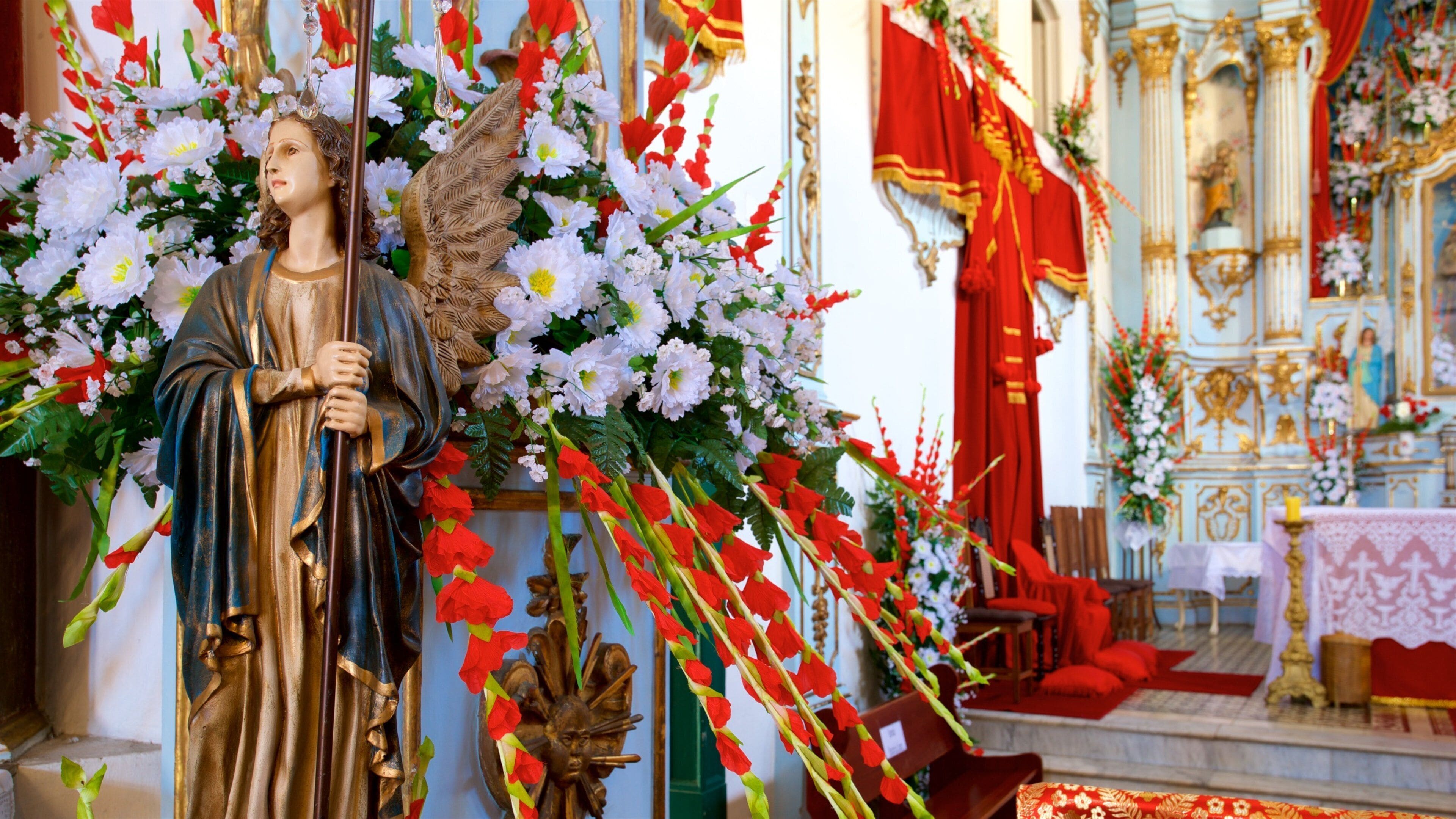 Nossa Senhora da Conceicao Church featuring religious elements, a church or cathedral and interior views