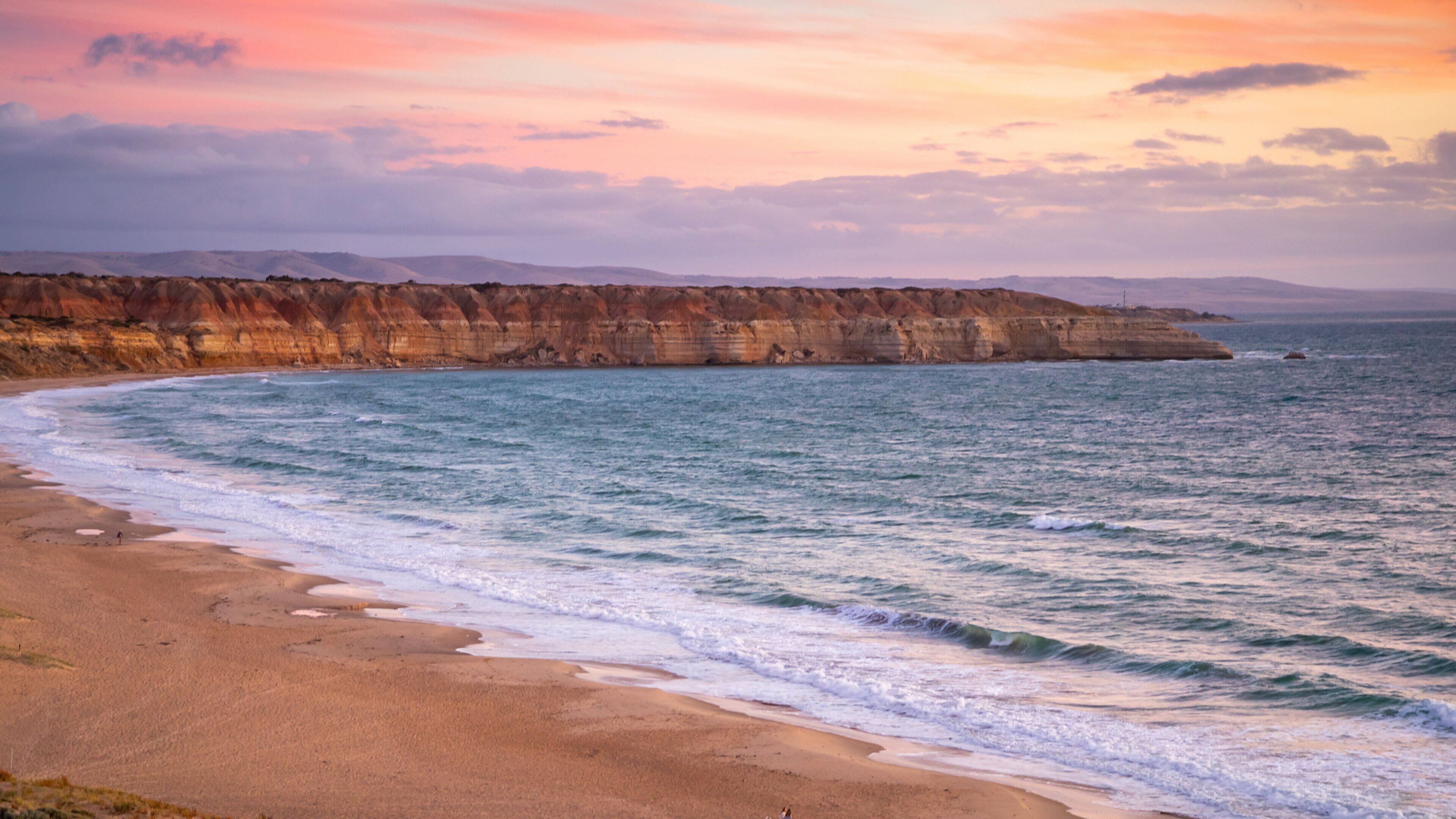 Maslin Beach featuring landscape views, a sunset and rocky coastline