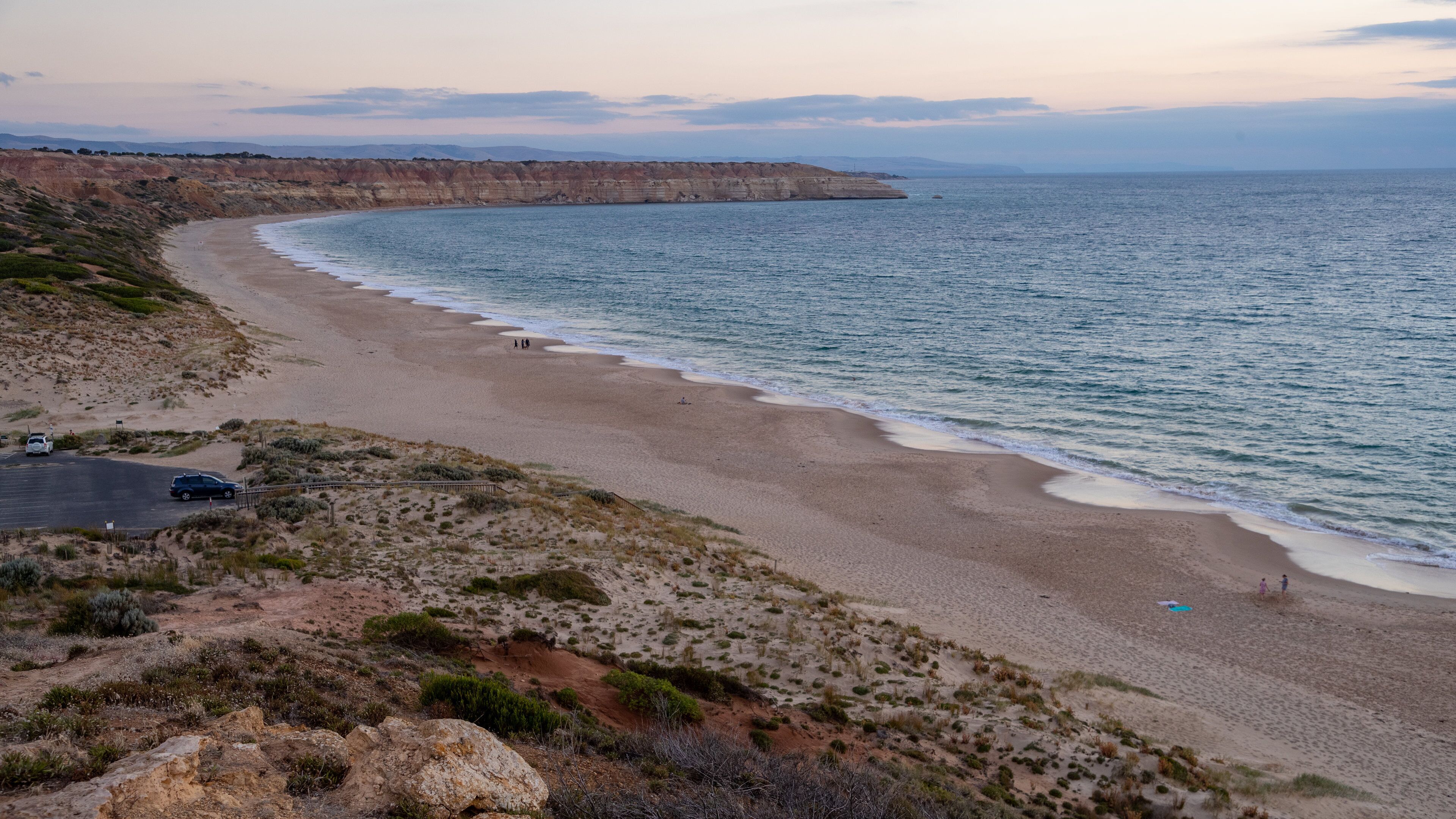 Maslin Beach which includes a beach, a sunset and general coastal views