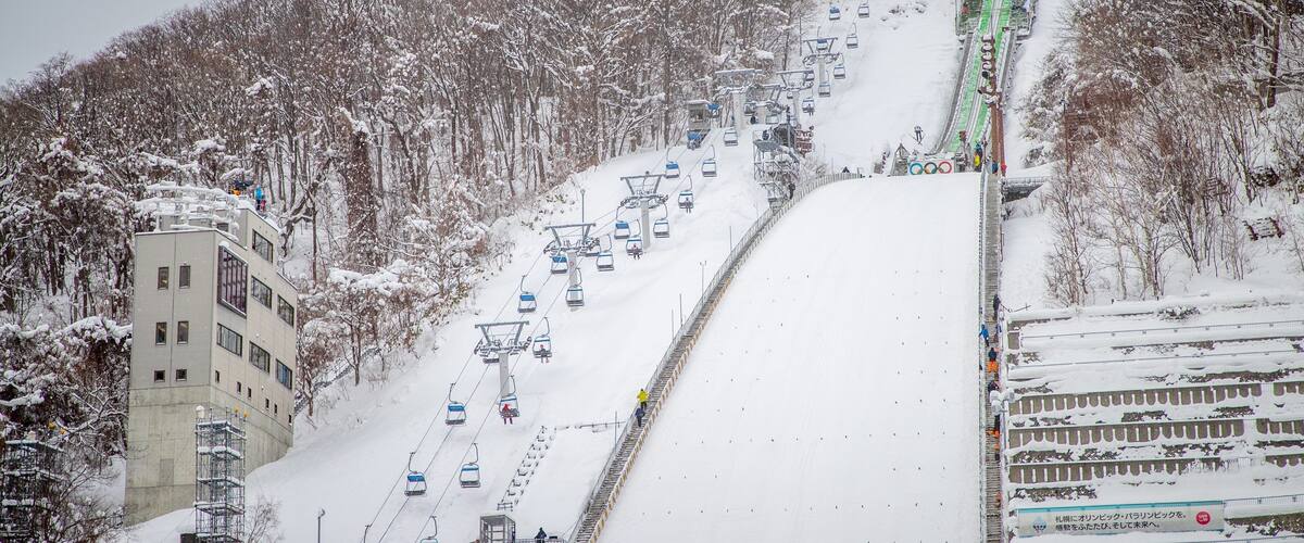 Sapporo Winter Sports Museum showing a gondola, mountains and snow