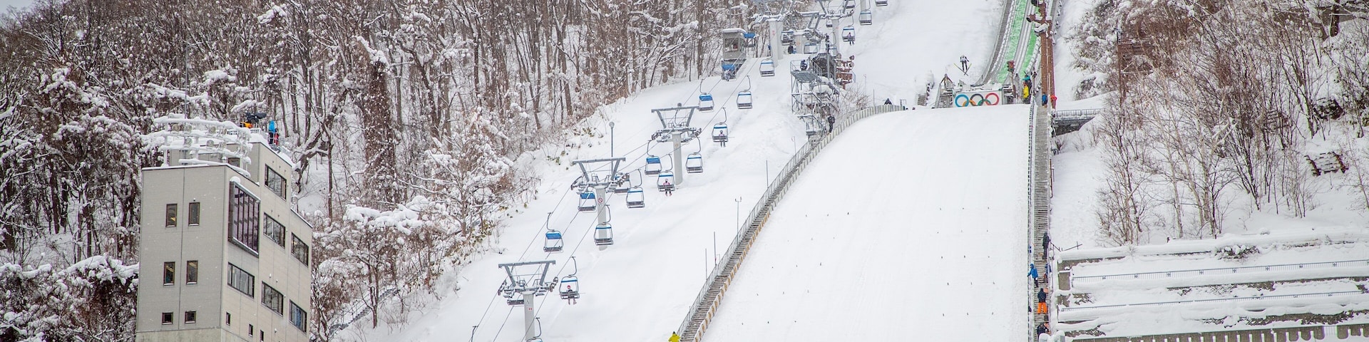 Sapporo Winter Sports Museum showing a gondola, mountains and snow