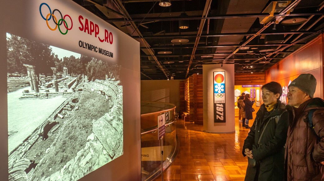 Sapporo Winter Sports Museum featuring interior views and signage as well as a couple