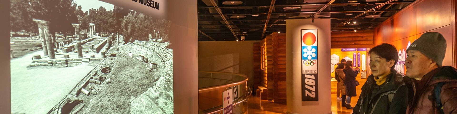 Sapporo Winter Sports Museum featuring interior views and signage as well as a couple