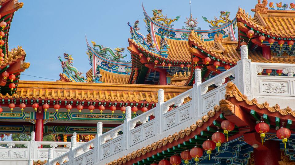 A traditional Chinese building with ornate roofs, red lanterns, and intricate carvings.