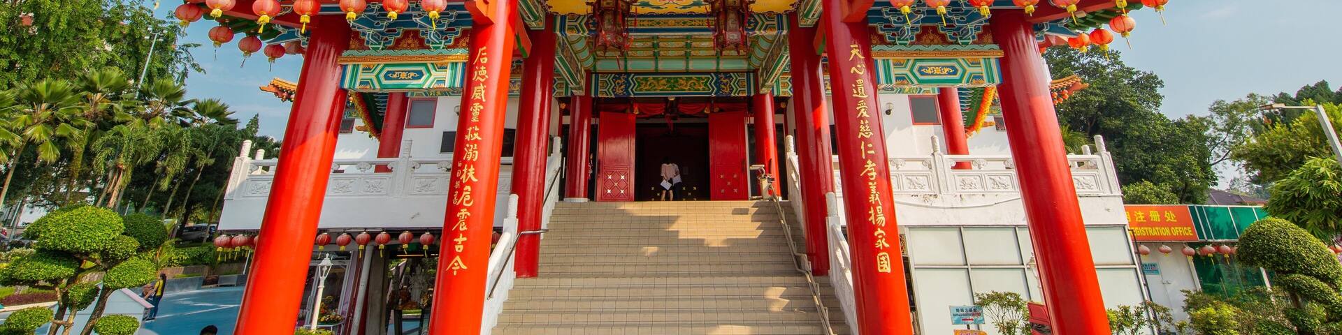 A traditional Chinese gate with red pillars and ornate decorations.