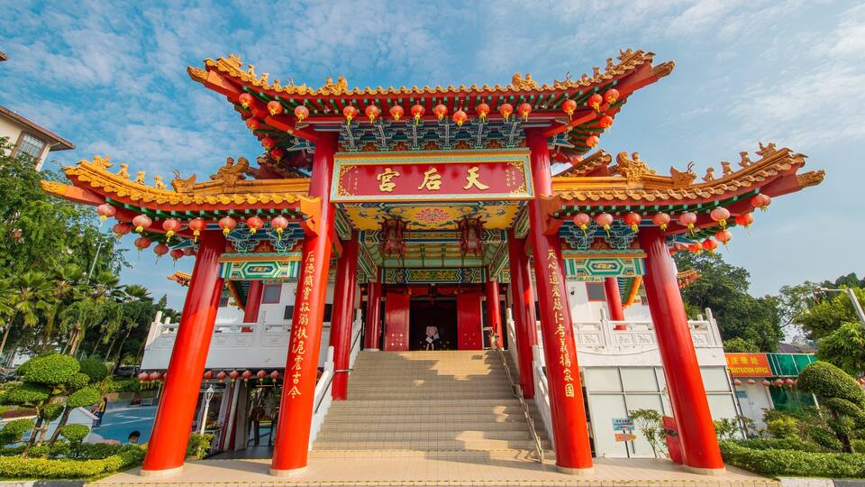 A traditional Chinese gate with red pillars and ornate decorations.