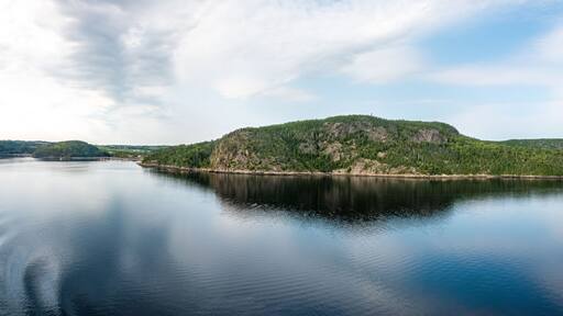Gorgeous calm sea landscapes along the Saguenay fjord between La Baie and Tadoussace, Quebec, Canada