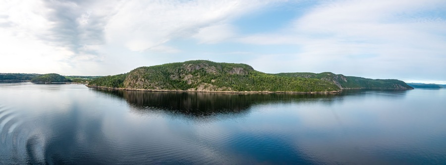 Gorgeous calm sea landscapes along the Saguenay fjord between La Baie and Tadoussace, Quebec, Canada