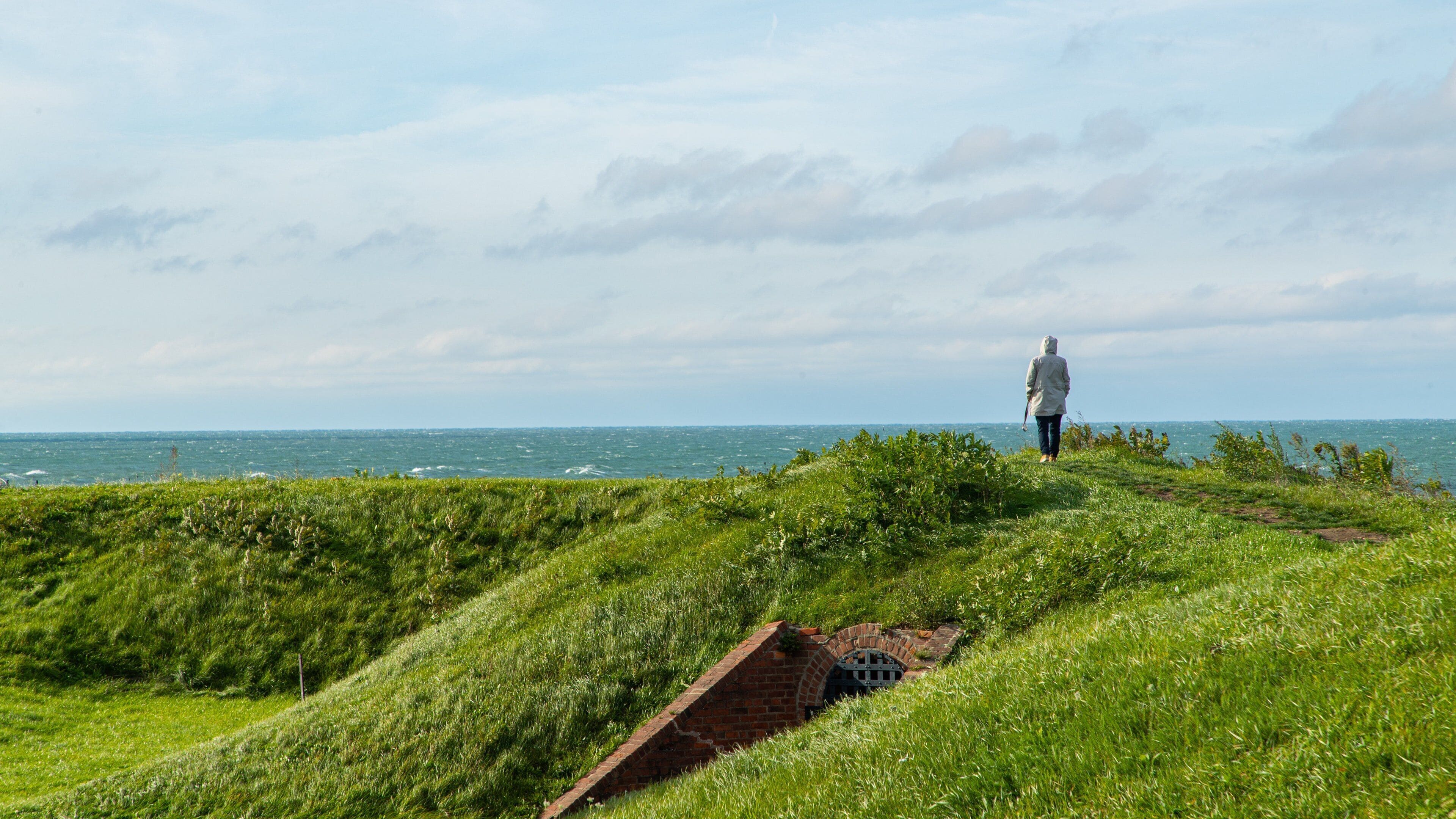 Fort Mississauga featuring general coastal views as well as an individual femail