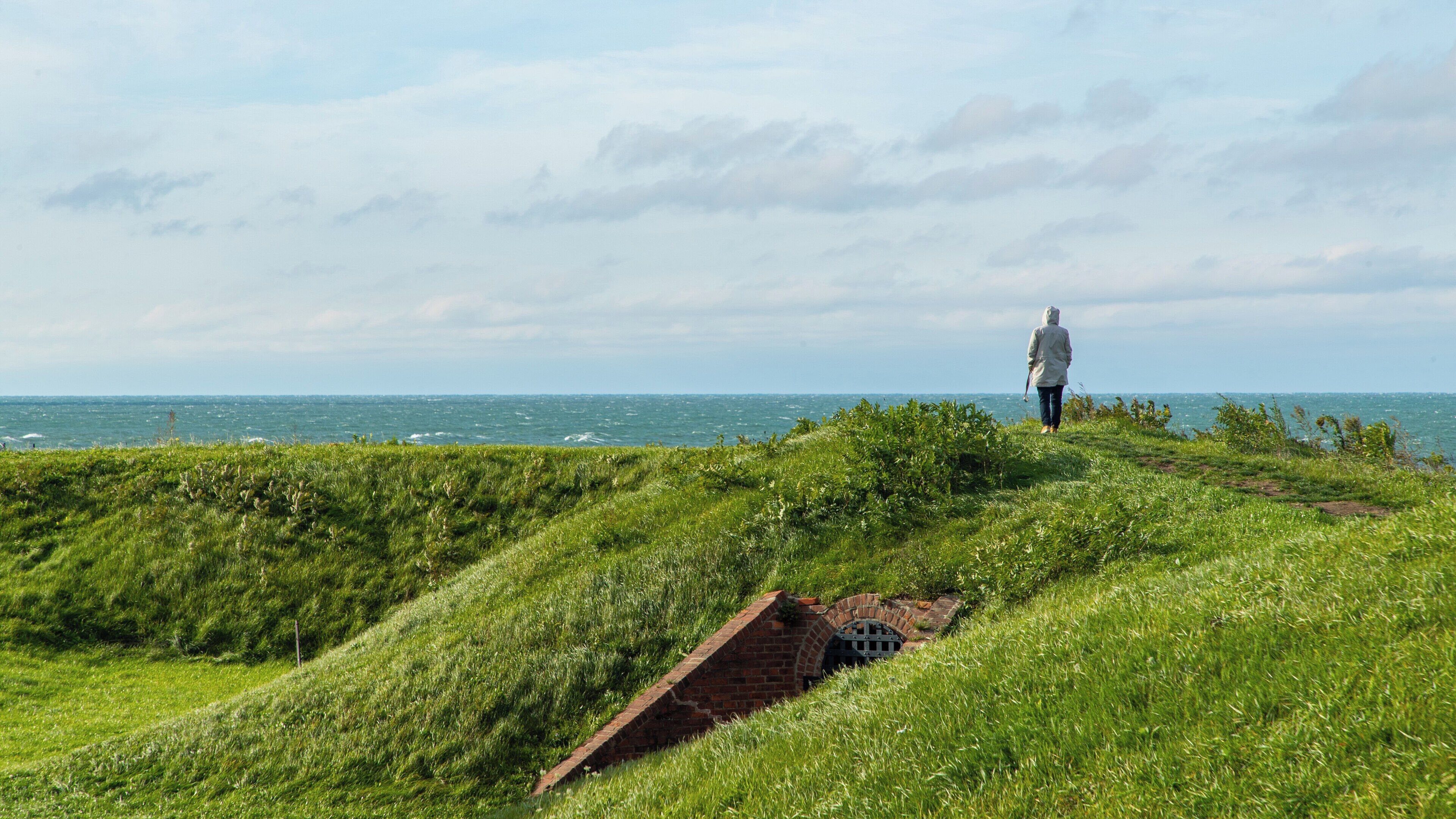 Exploring Fort Mississauga in Niagara-on-the-Lake, Ontario with a view of Lake Ontario under cloudy skies