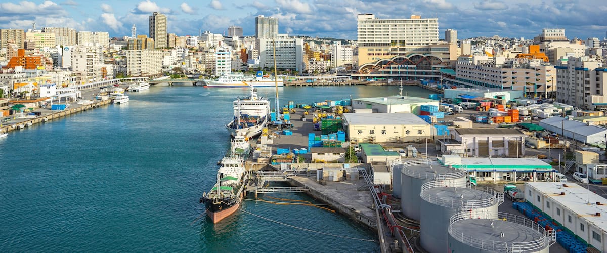 M49H1P Tomari Port with Okinawa city skyline in Naha, Okinawa, Japan.