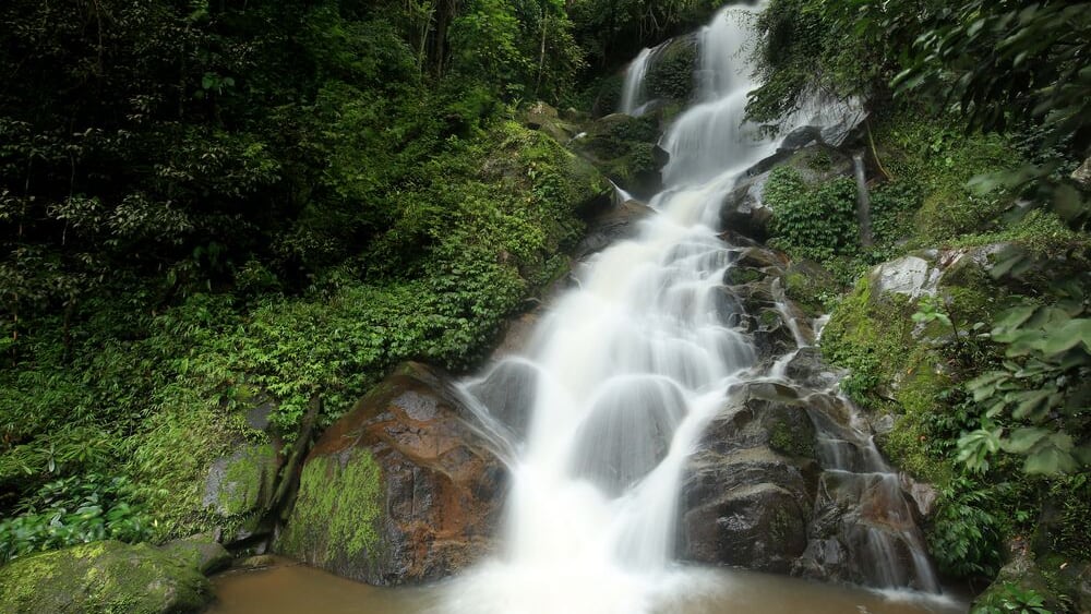 Huay Kaew Waterfall, Paradise waterfall in Tropical rain forest of Thailand , deep forest water fall in Chaingrai ; Shutterstock ID 321738395; PO: Hcom Destination Content neighborhoods; Client: Hotel