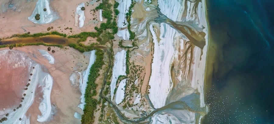 Along the eastern side of the Salton Sea the water flows into the sea and creates all kinds of beautiful colors & patterns. For a bit of scale notice the myriad of seagulls in the lower right of the image waiting for food...
#drone #aerial