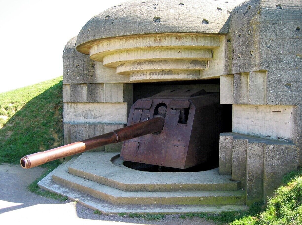 One of four German navy guns positioned at Longues-sur-Mer as part of Hitler's Atlantic Wall.  On D-Day these guns fired over 170 rounds at British and American warships, though by nightfall the warships had taken out three them.  The next day the entire crew - some 184 men - surrendered to advancing Allied forces.
