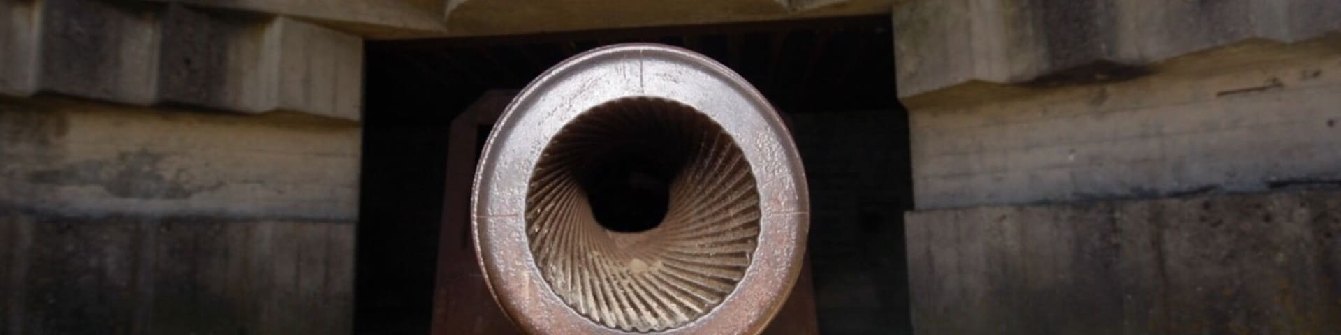 The latest anti-aircraft gun from World War 2 in France. The sun was shining in the middle of the barrel ....