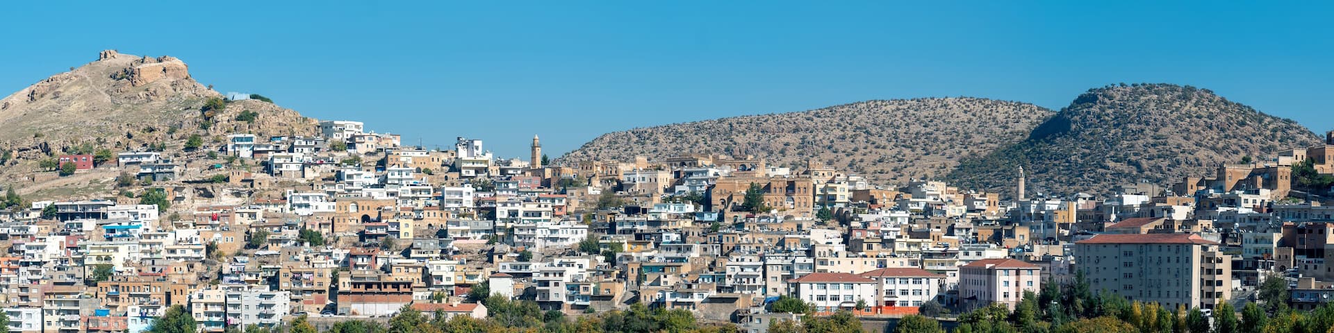 Savur, Mardin, Turkey - January 2020: Town of Savur skyline with old stone houses on a hill