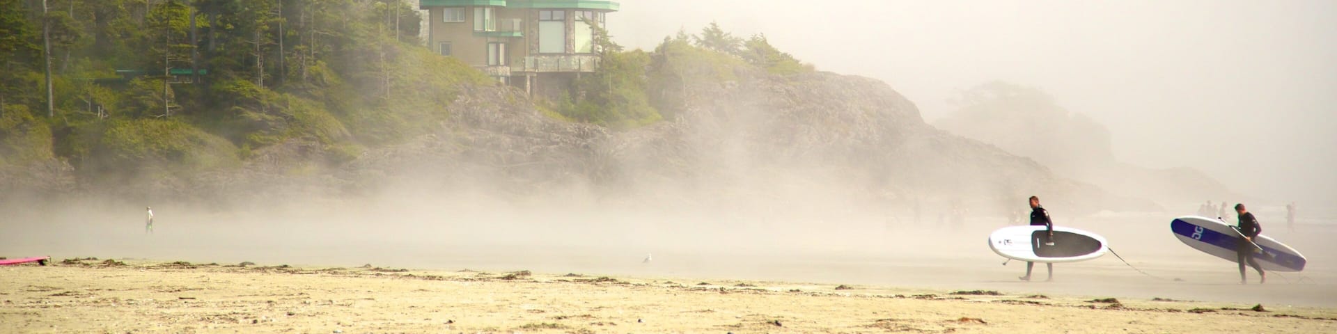 Mackenzie Beach showing mist or fog, a sandy beach and surfing