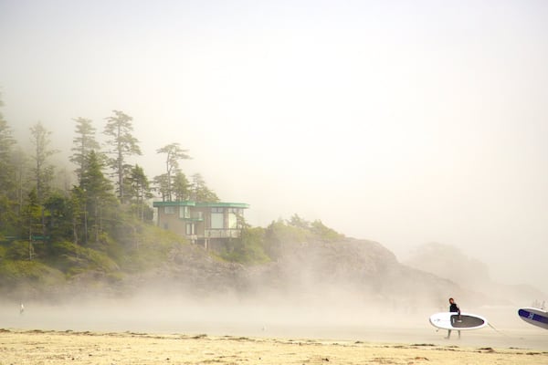 Mackenzie Beach showing mist or fog, a sandy beach and surfing