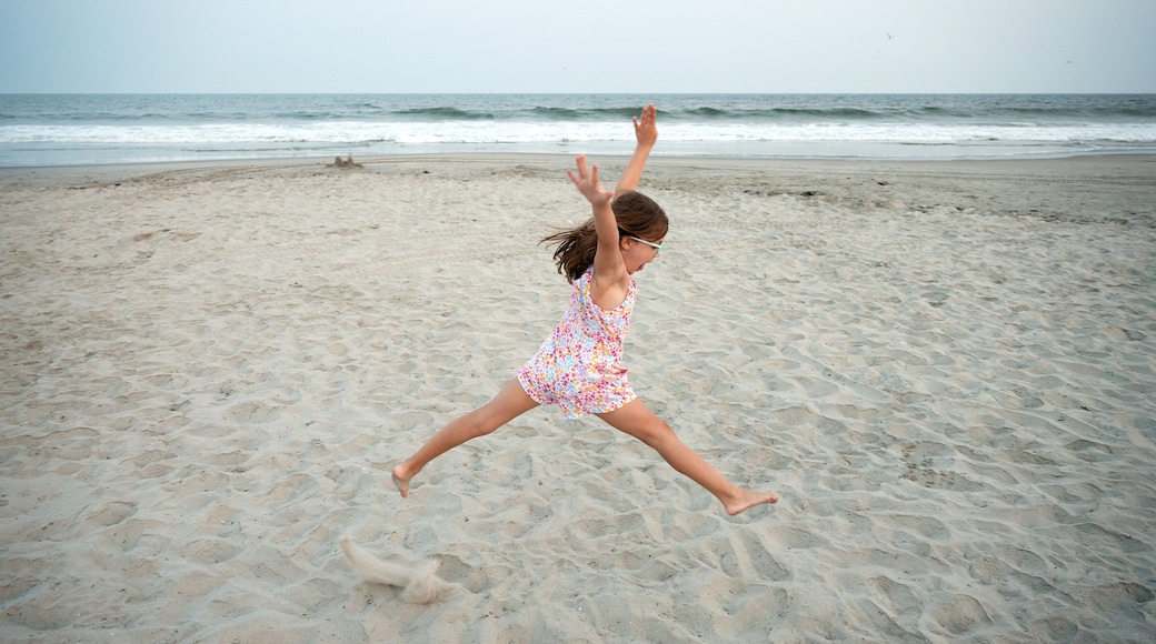 young girl dancing on the beach