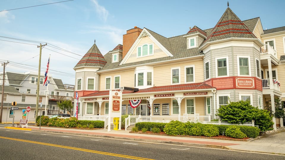 A historic building with a sign for Farina & Boeshe Real Estate Co. and a 'Rentals' sign.