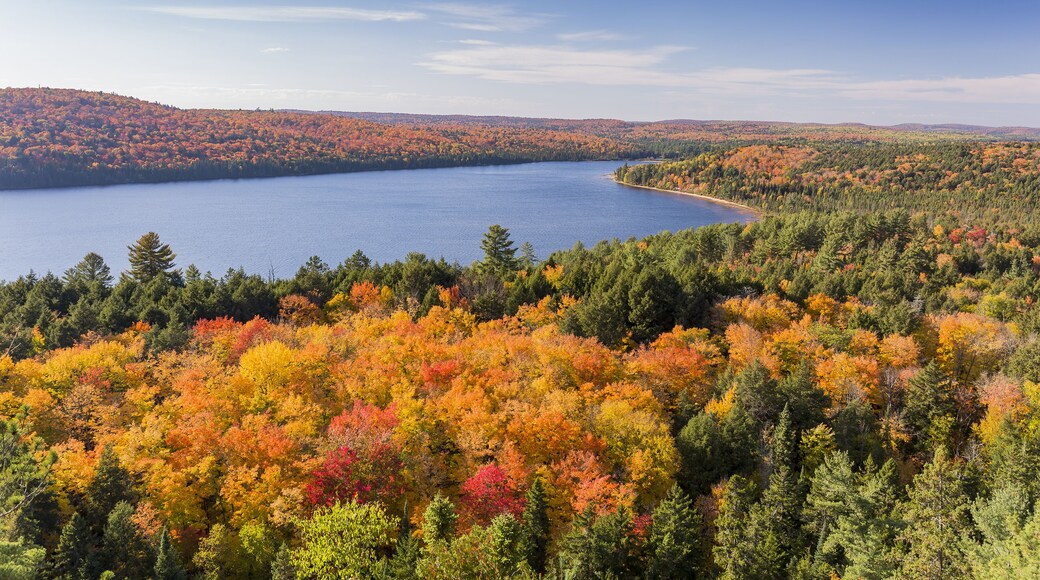 Overlooking a lake surrounded by brilliant fall foliage - Algonquin Provincial Park, Ontario, Canada