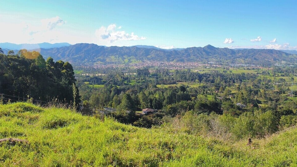 A mountainous landscape with a town nestled in the valley.