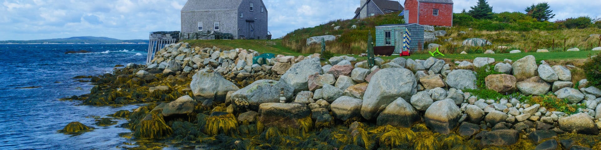 Rocky shore and houses in the fishing village Indian Harbour