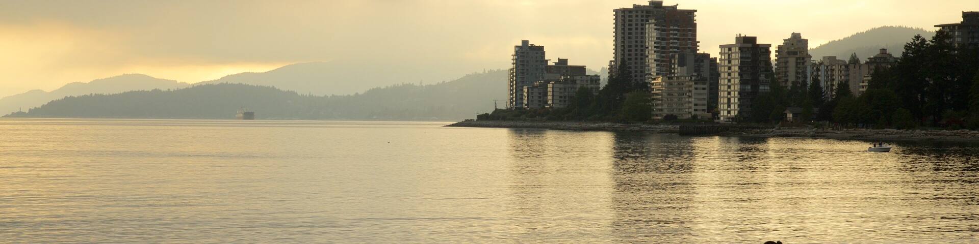 Ambleside Park which includes a sunset, a city and a coastal town