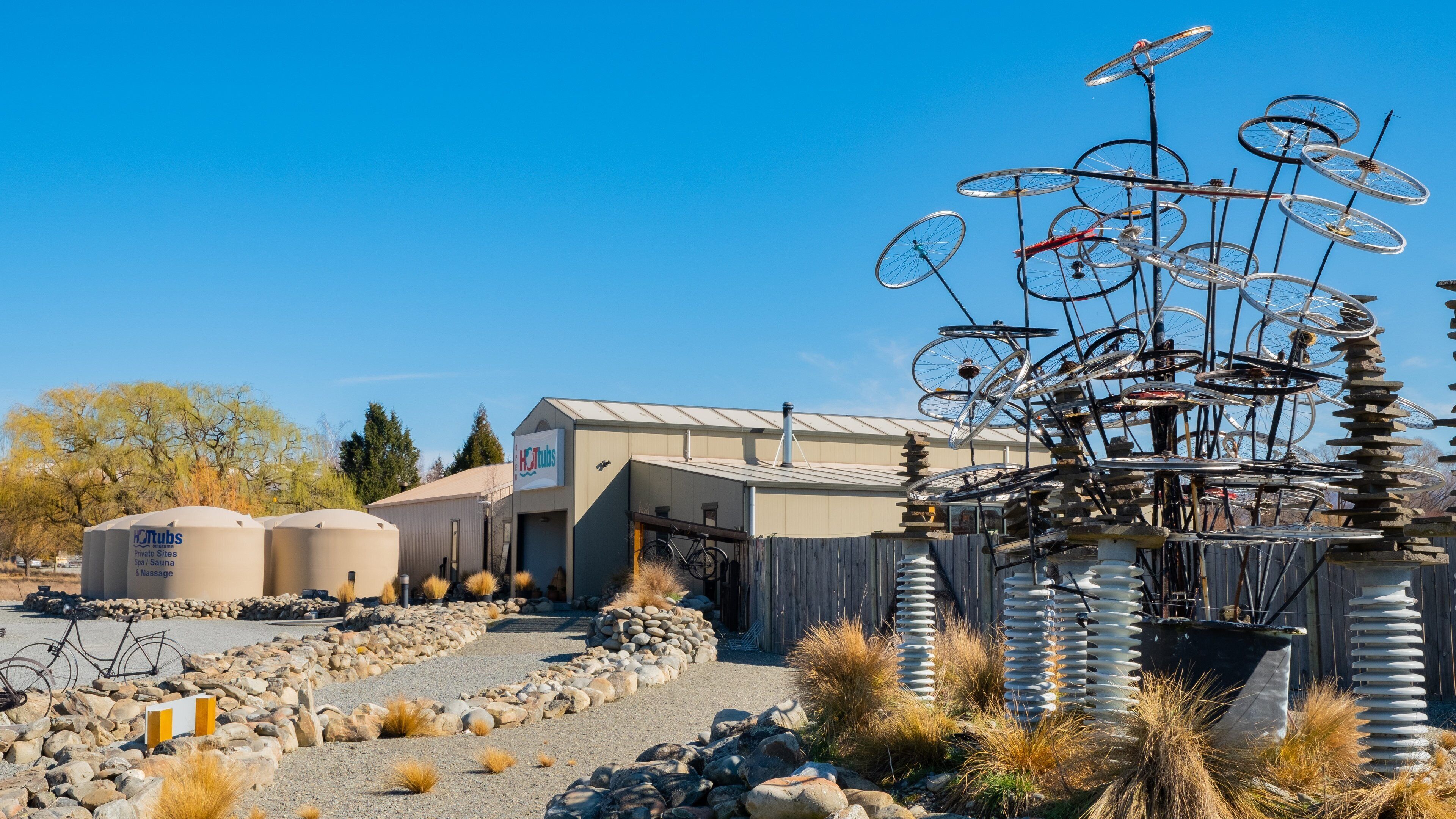 A spa facility with a unique bicycle sculpture in the foreground.