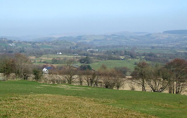 Across the Teifi Valley towards Llanio, Ceredigion The skyline rises to the right, to the forest at Bryn Du, and the Elenydd moorlands.