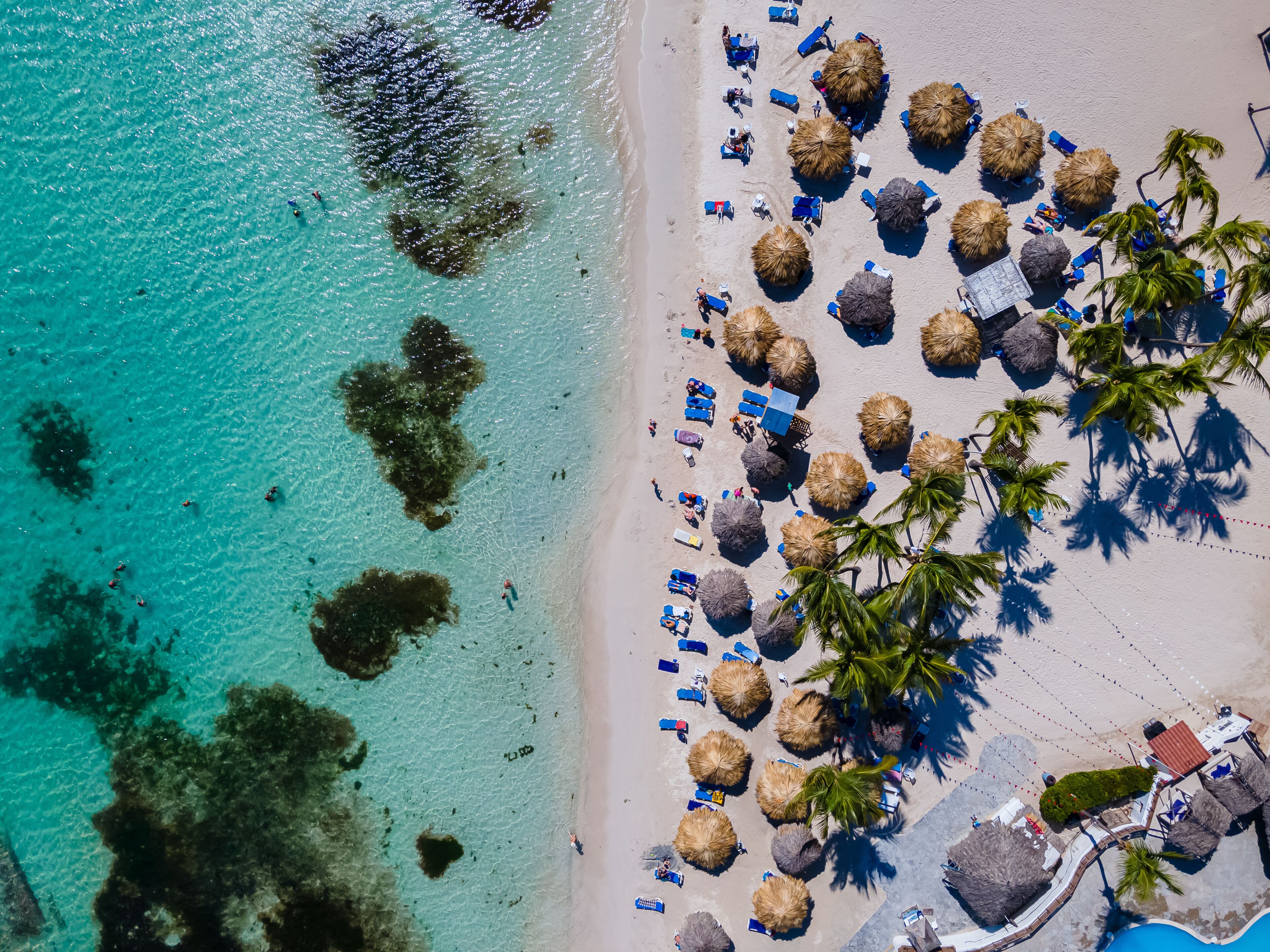 Beautiful aerial view of Boca Chica beach, its turquoise waters, resorts near the Santo Domingo Airport in Dominican Republic