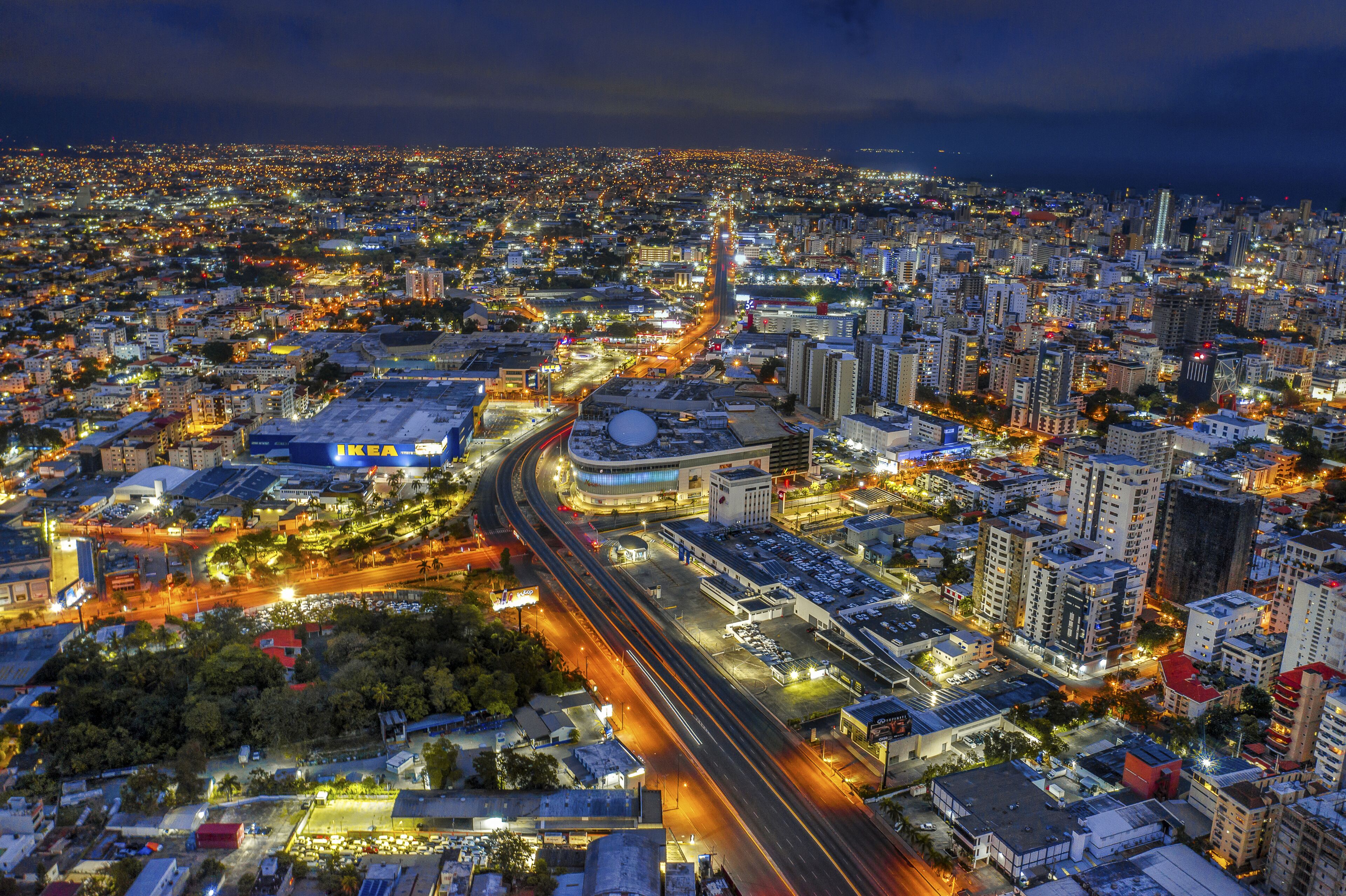 Cityscape of Santo Domingo surrounded by lights at night in the Dominican Republic