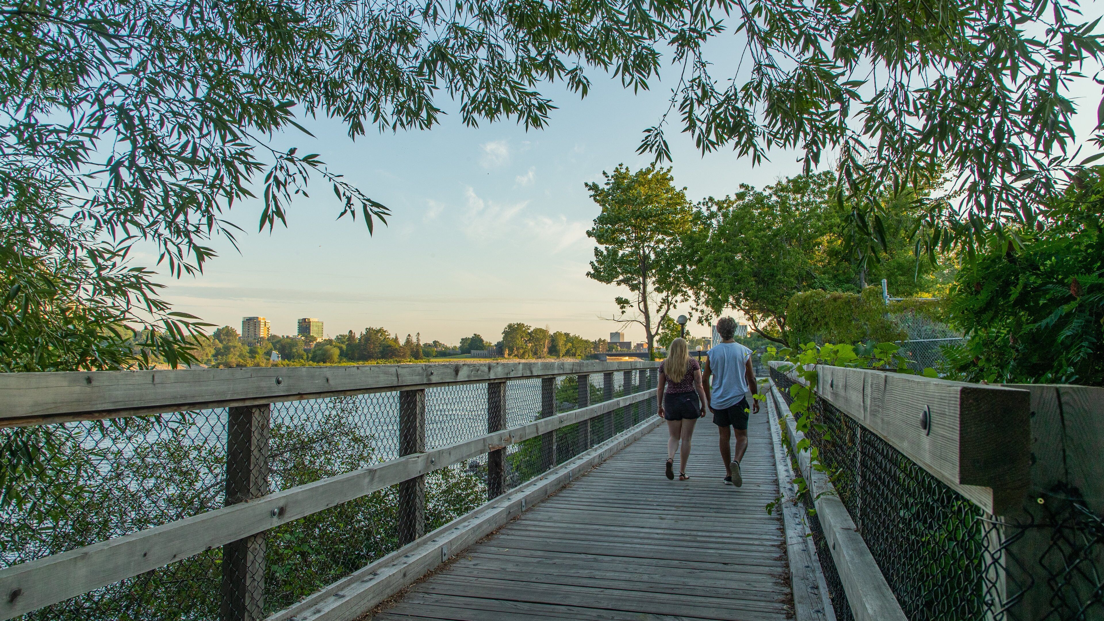Voyageur Provincial Park featuring a river or creek and a sunset as well as a couple