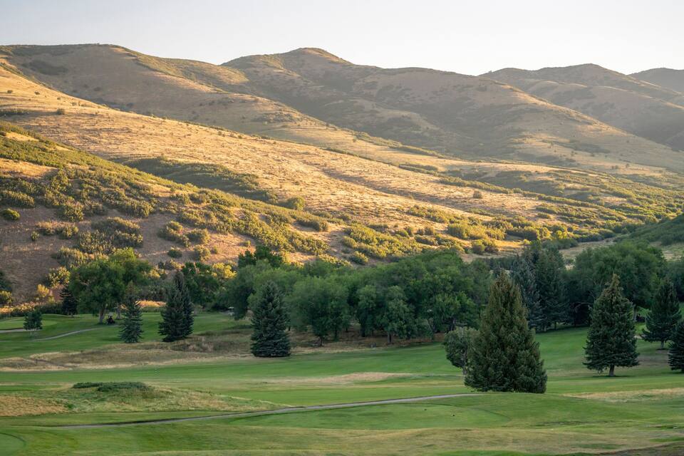 A mountainous landscape with a golf course.