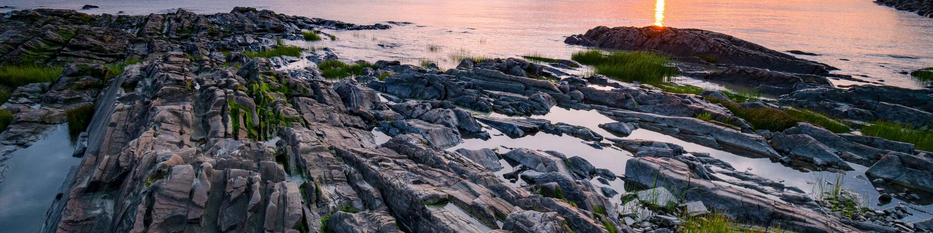 Wonderful sunset at St-Jean-Port-Joli's coasts, at low tide, on the shore of St-Lawrence river.
