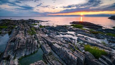 Wonderful sunset at St-Jean-Port-Joli's coasts, at low tide, on the shore of St-Lawrence river.