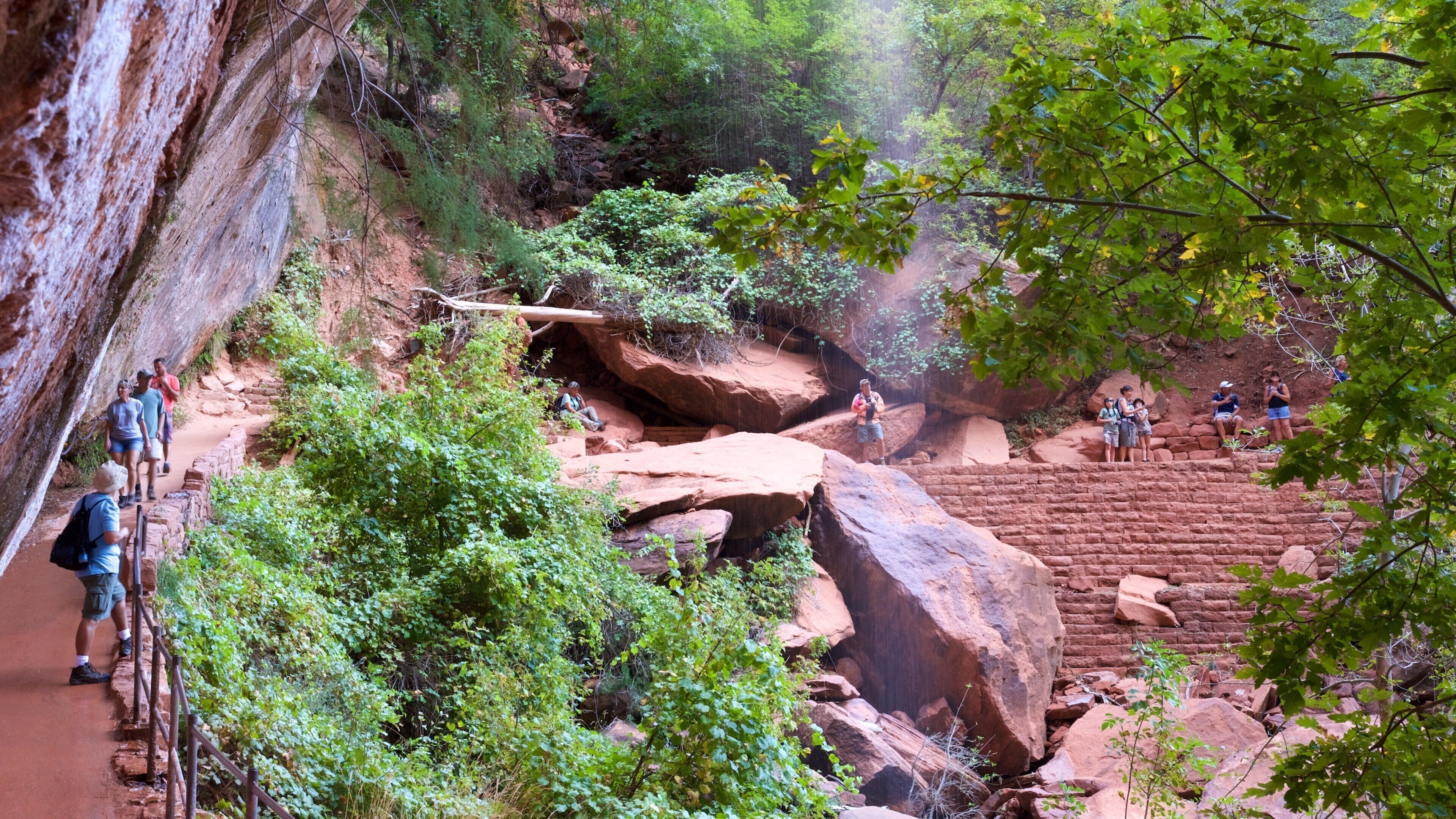 Emerald Pools which includes tranquil scenes and hiking or walking as well as a small group of people